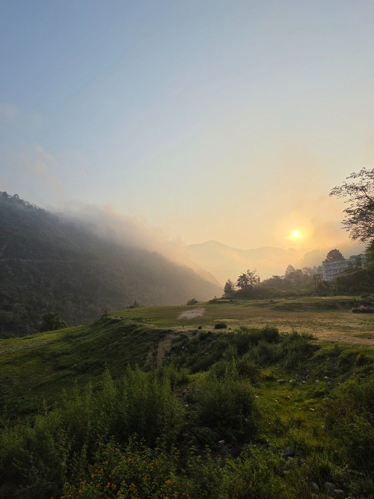 Misty sunrise warming the green valleys of Rudraprayag