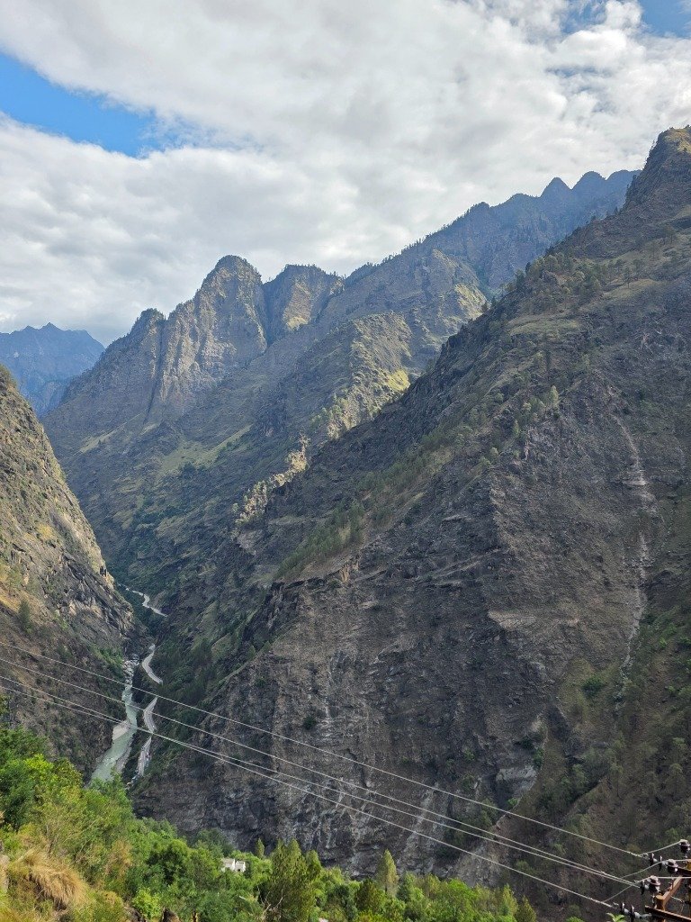Winding river path through deep Himalayan valley